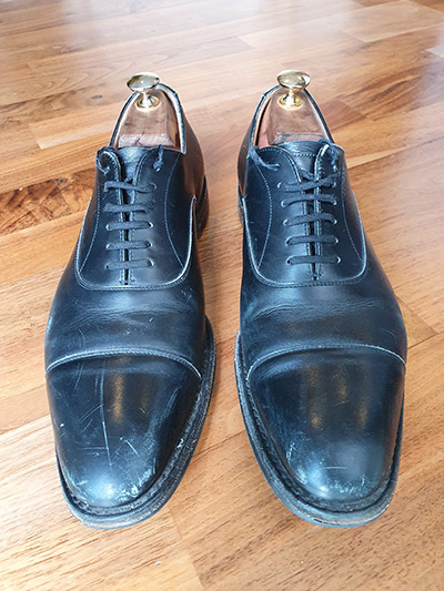 Pair of black, scuffed and scratched Churchs
